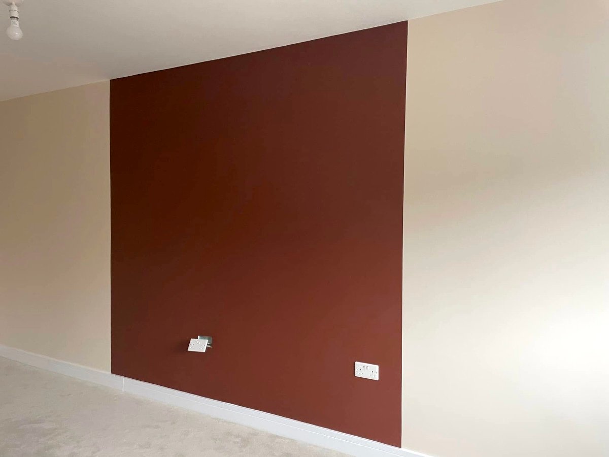 Feature wall painting in Newport by Orchid Decor, burgundy bedroom accent wall