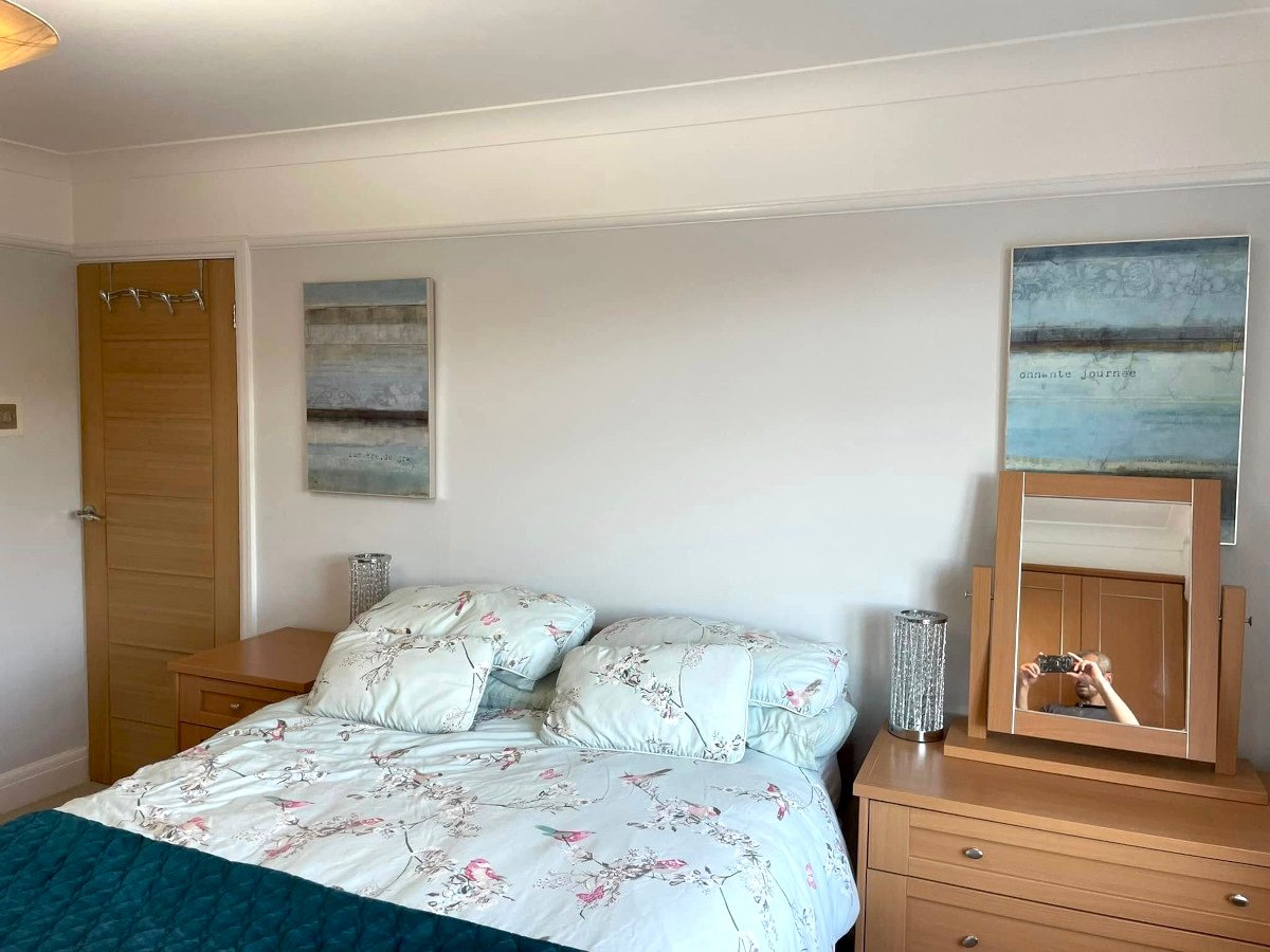 bedroom-grey-painted-walls-double-bed-artwork-newport-orchid-decor Bedroom painting in Newport by Orchid Decor, grey painted walls with double bed and artwork