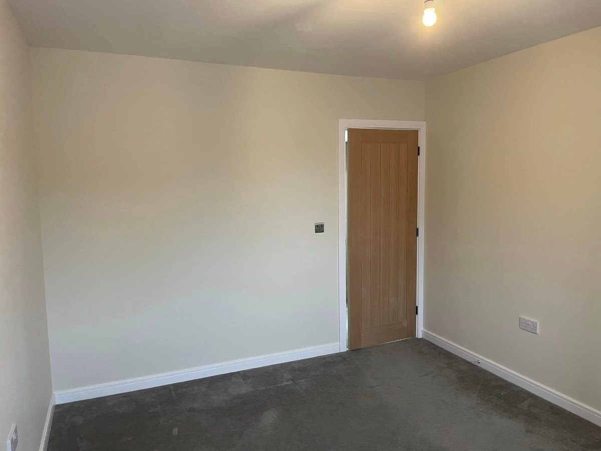 Empty room with grey painted walls ready for home office conversion in Newport