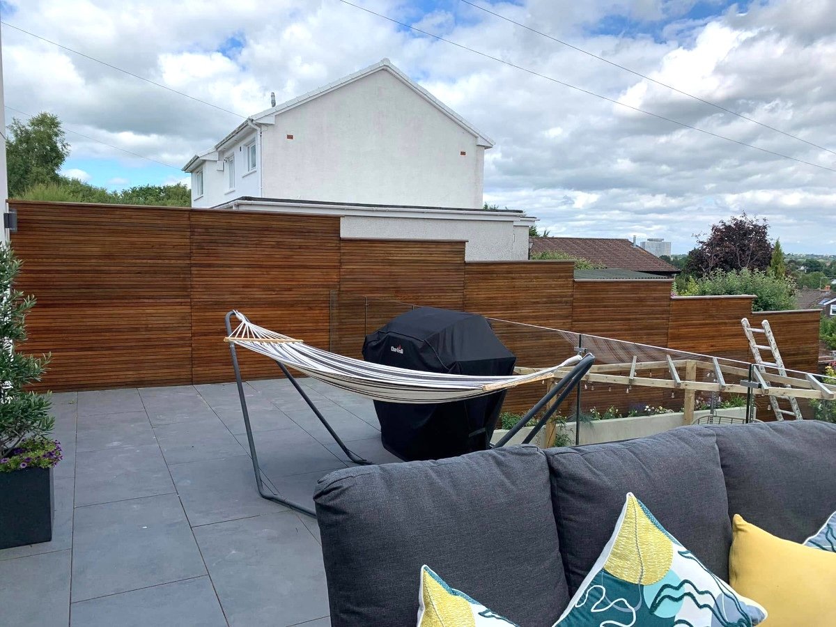 Garden fence painted after treatment in Newport by Orchid Decor