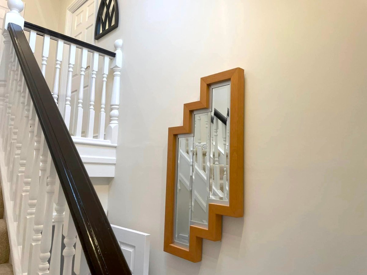 Hallway painting in Newport by Orchid Decor, cream painted walls with staircase and mirror