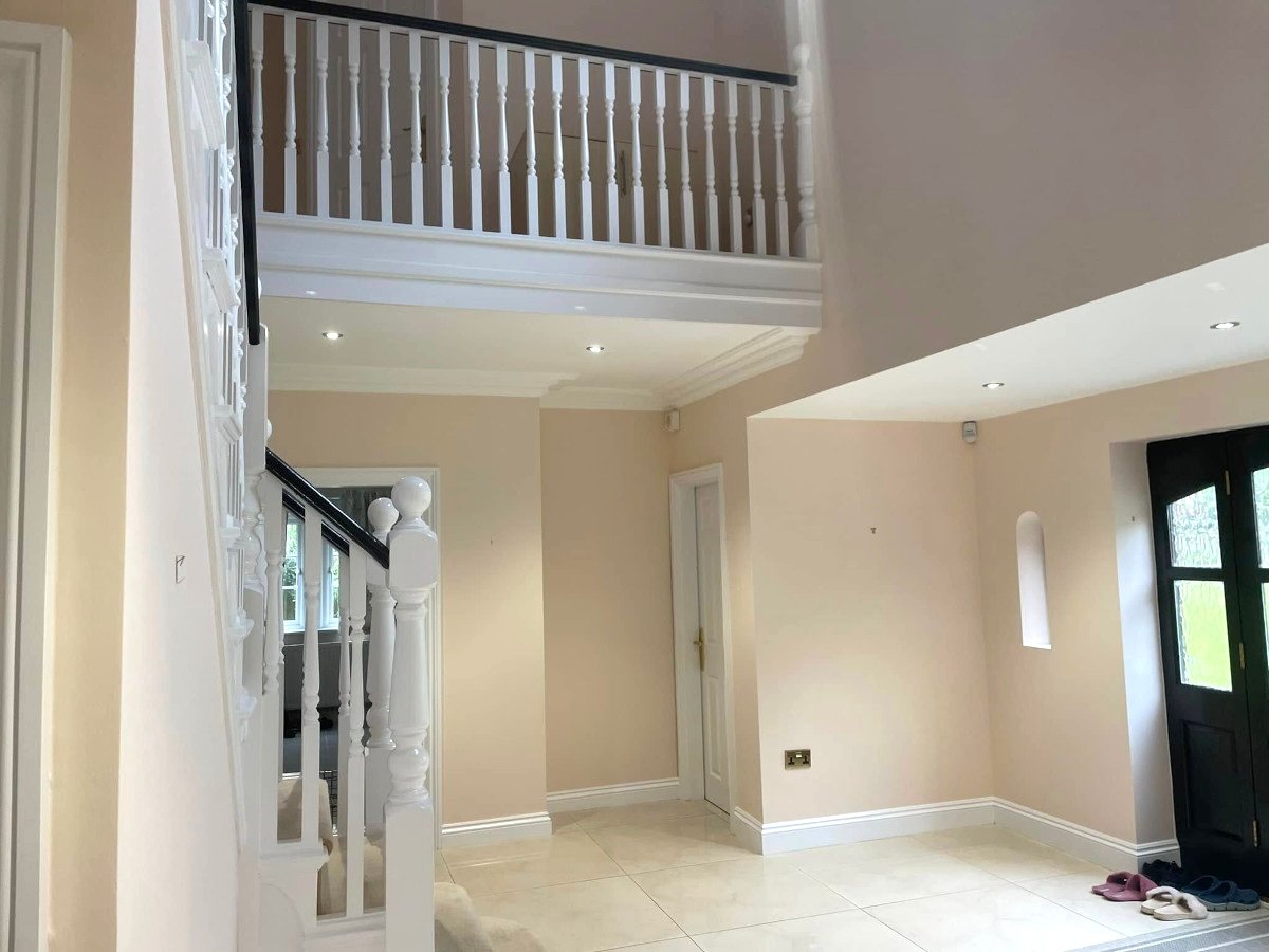 Hallway cream painted walls with staircase and upper landing in Newport