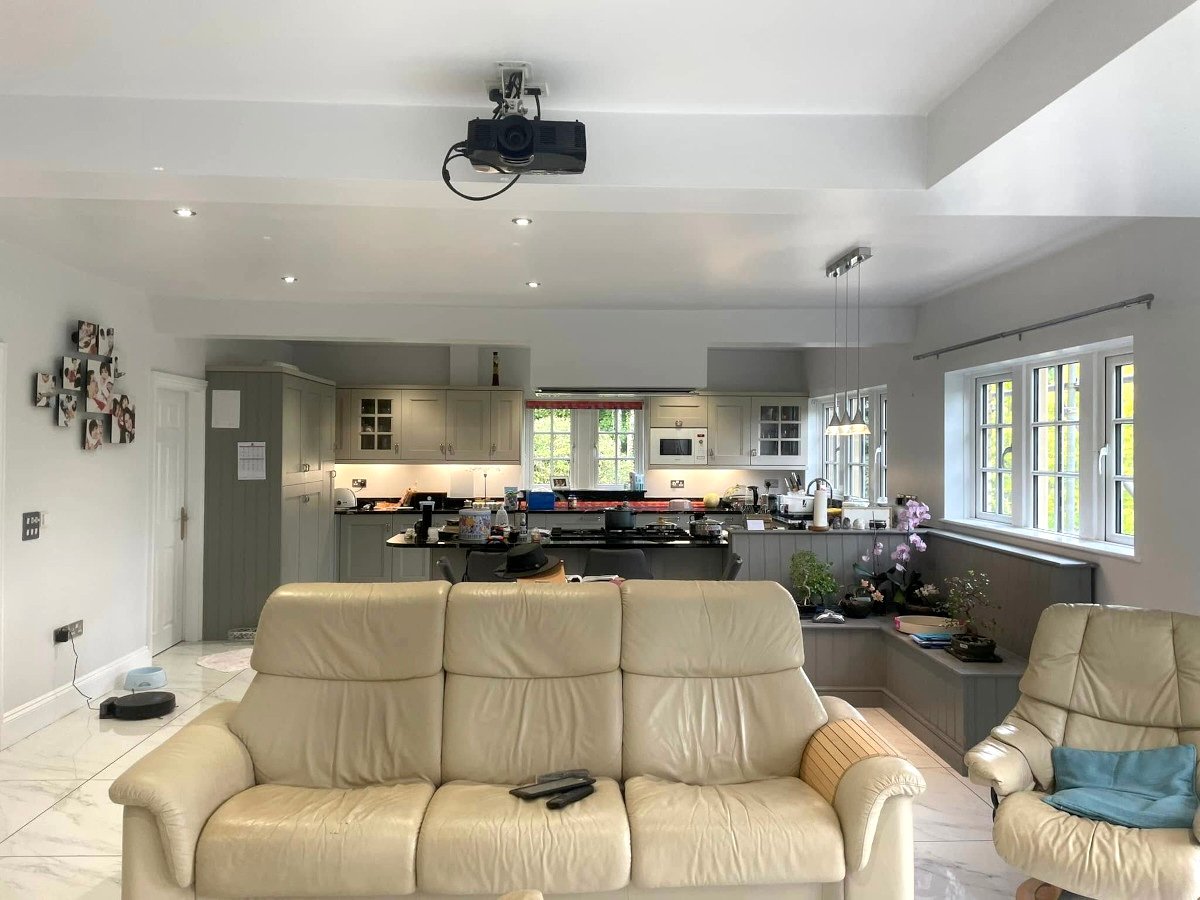 Open plan kitchen diner extension with freshly painted grey walls, Newport