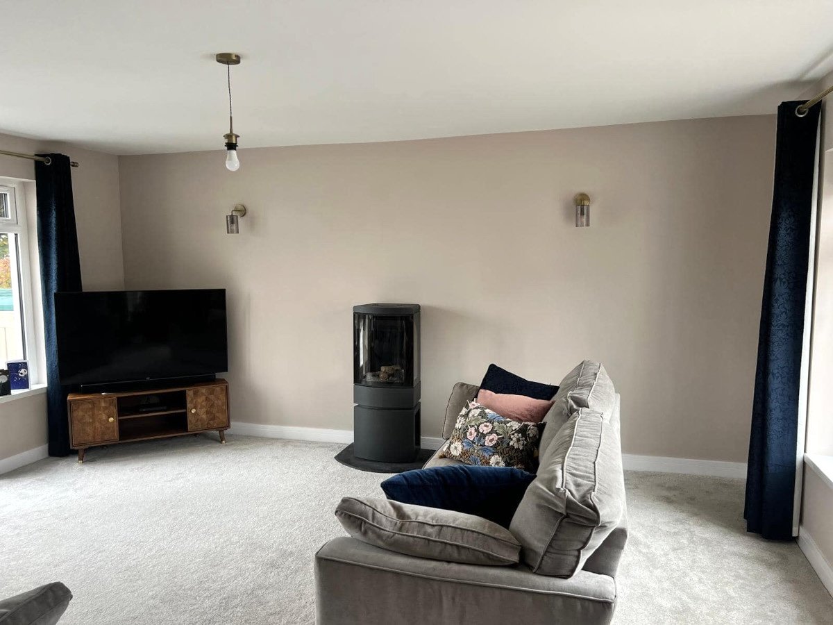 living-room-beige-painted-walls-wood-burner-stove-newport-orchid-decor Living room with beige painted walls and wood burner stove in Newport property