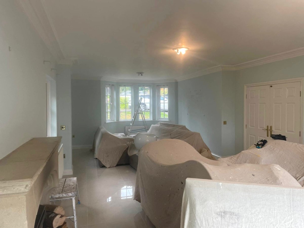 Living room with blue grey painted walls and bay window in Newport