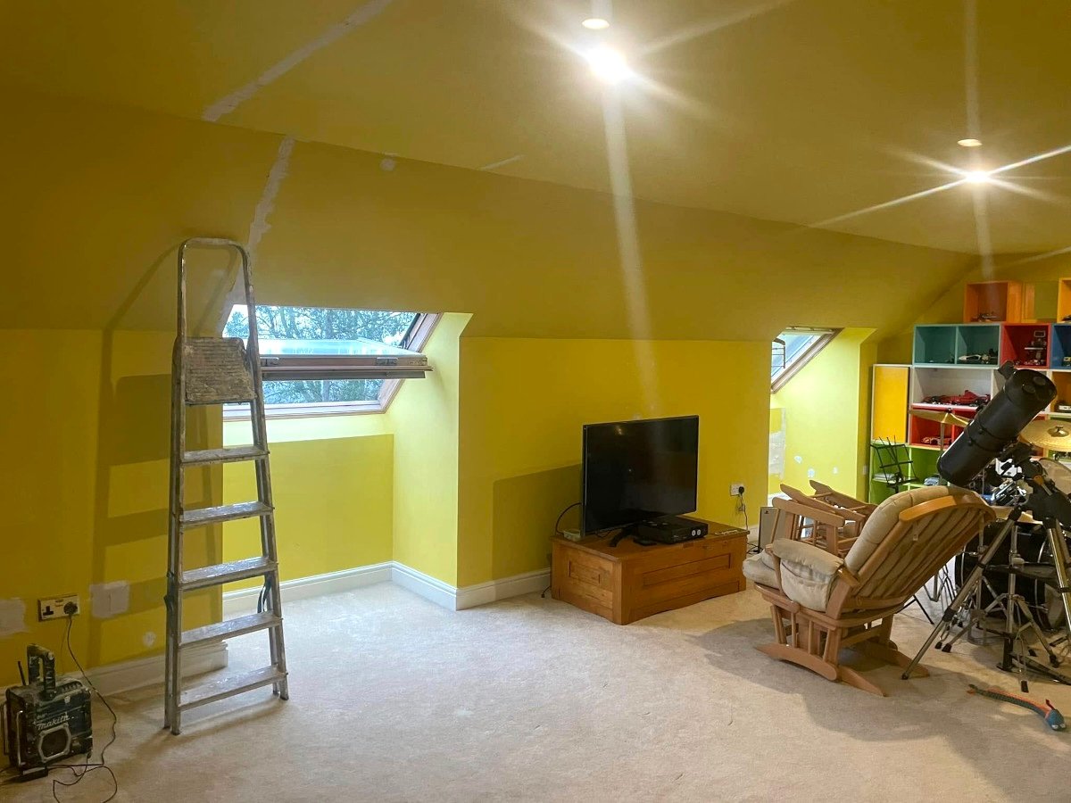 loft bedroom yellow painted walls skylights ladder newport orchid decor