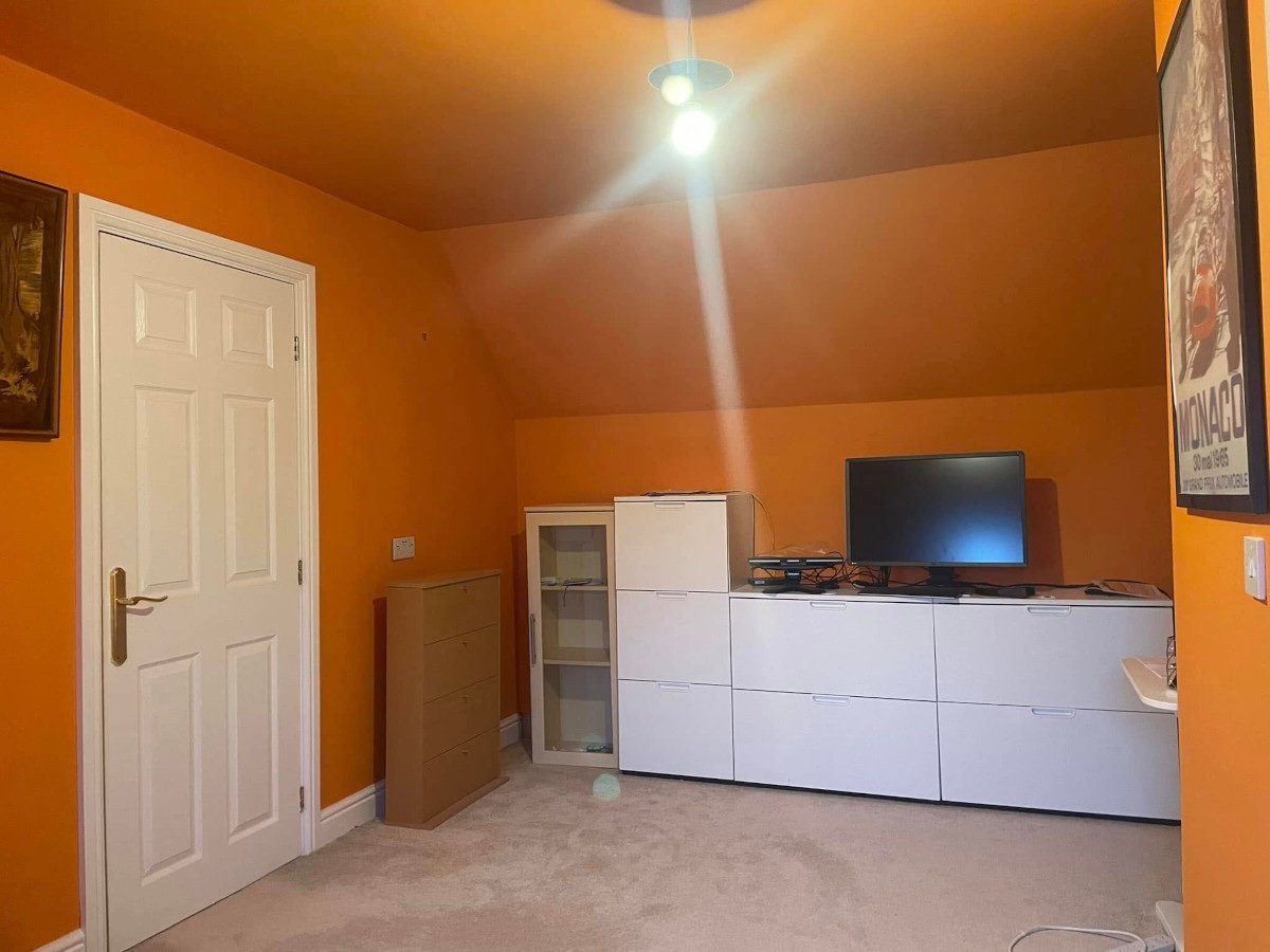 Loft office with orange painted walls and ceiling in Newport by Orchid Decor