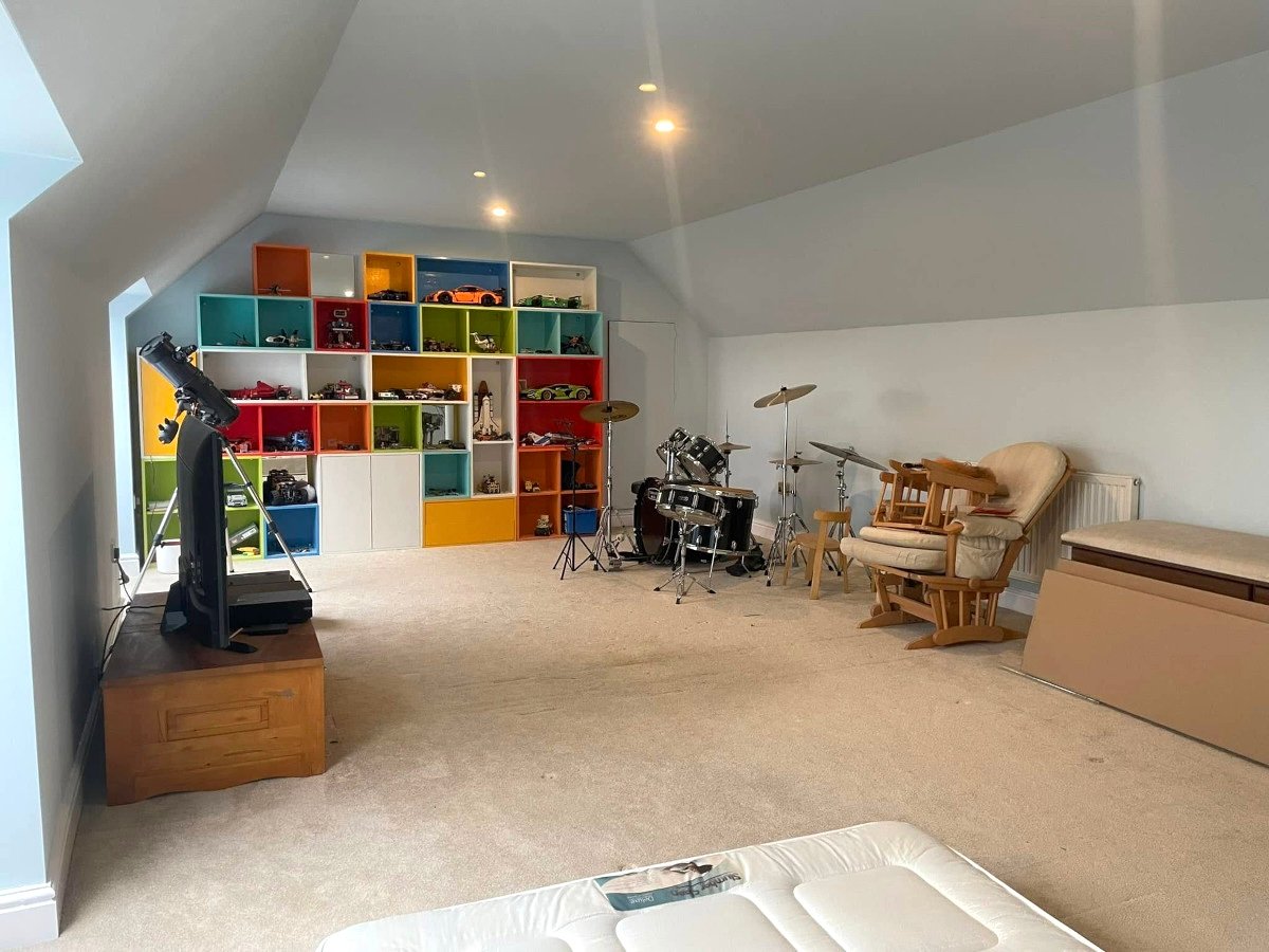 loft-room-white-painted-walls-colorful-storage-drums-newport-orchid-decor loft room white painted walls colorful storage drums newport orchid decor