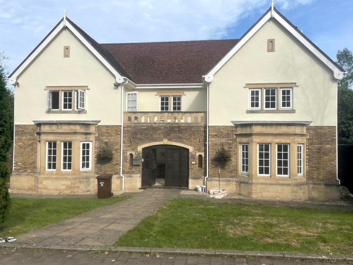 Newport house exterior after professional masonry painting by Orchid Decor