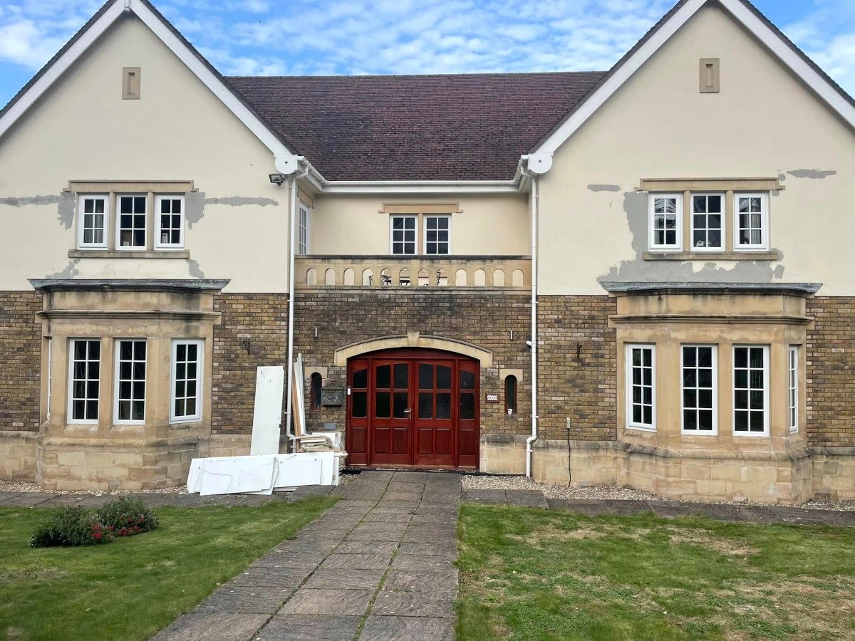 Newport house exterior and garage door before painting by Orchid Decor