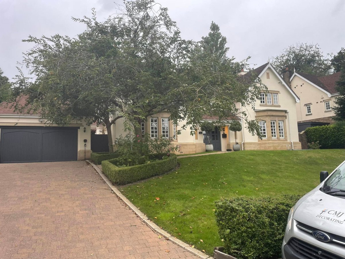 Window frame painting in Newport by Orchid Decor, professional exterior house with painted frames and garage door